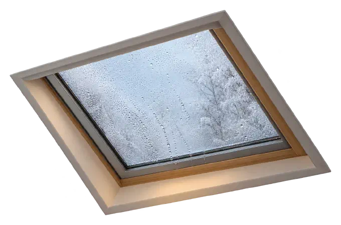 Condensation on a skylight in winter Skylight glass covered in condensation droplets with frost outside in winter.